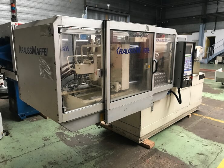 Presse à injecter KM  KRAUSS MAFFEI 65 -1350